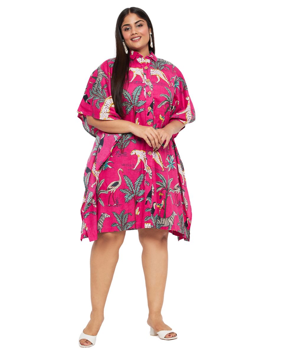 Plus size model in a pink button-front short kaftan with cheetah, flamingo and palm print