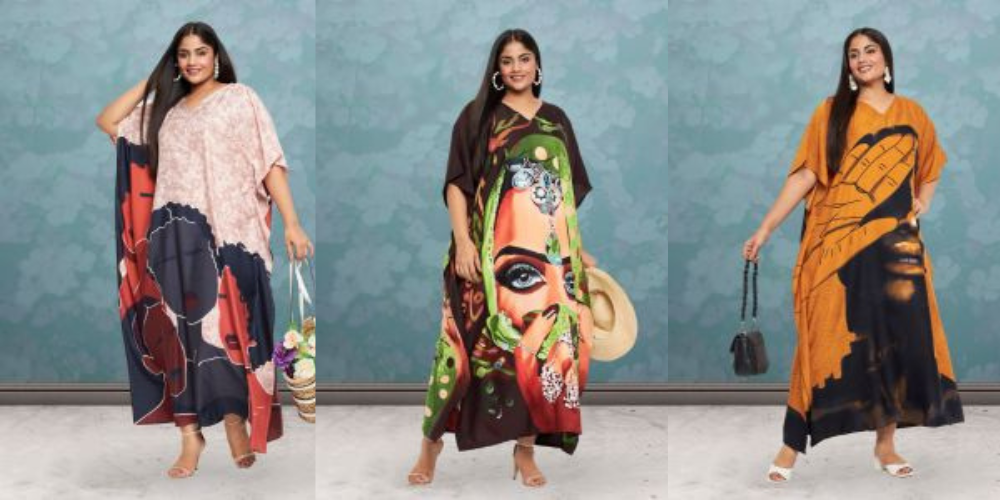 Three plus size models in face print kaftans in navy and pink, green and brown, and mustard