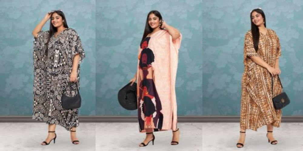 Three plus size models in kaftans: black and white tribal print, peach with an abstract face print, and brown geometric print