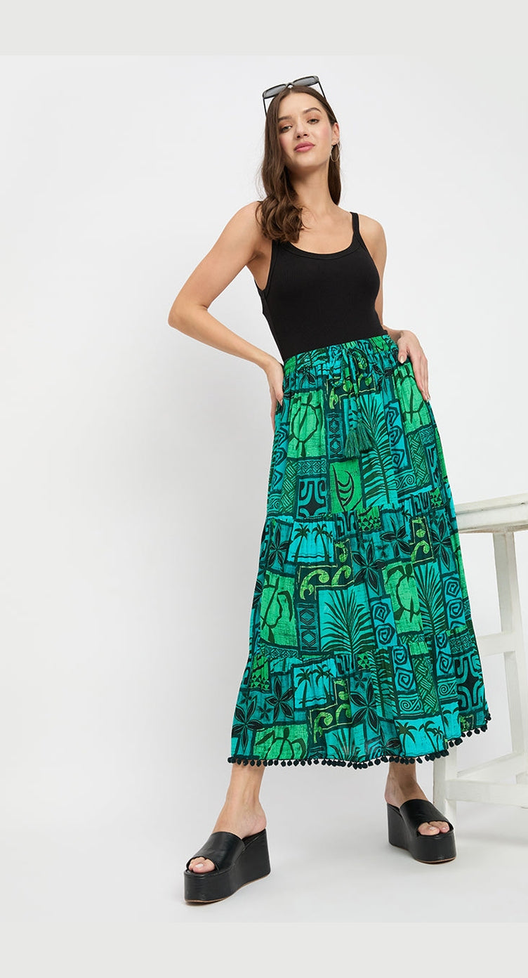 Green and teal tiki patchwork print rayon gathered maxi skirt, worn with a black tank top