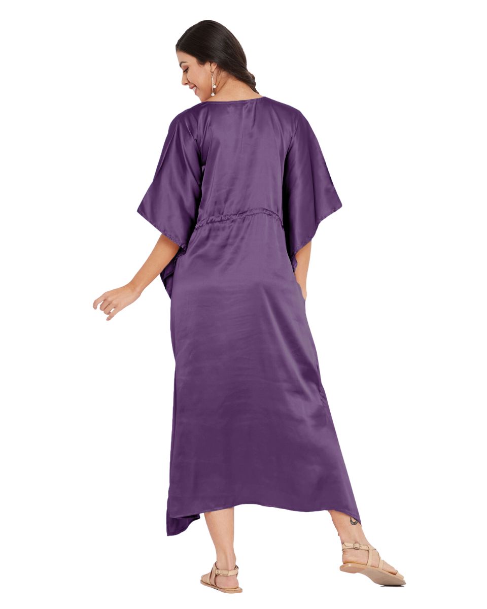 woman in satin kaftan dress