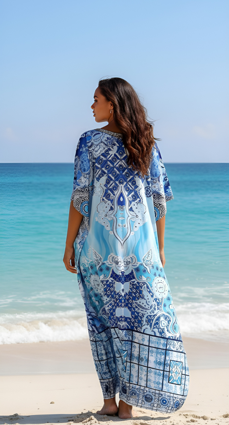 Azure blue satin plus size kaftan dress with blue and white porcelain print, embellished neckline — another angle