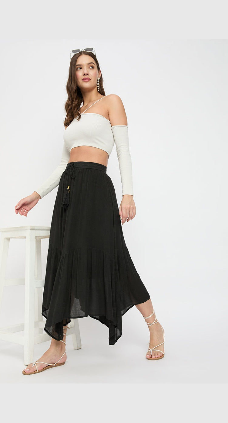 Black rayon handkerchief hem maxi skirt with elasticated waist, worn with a white crop top