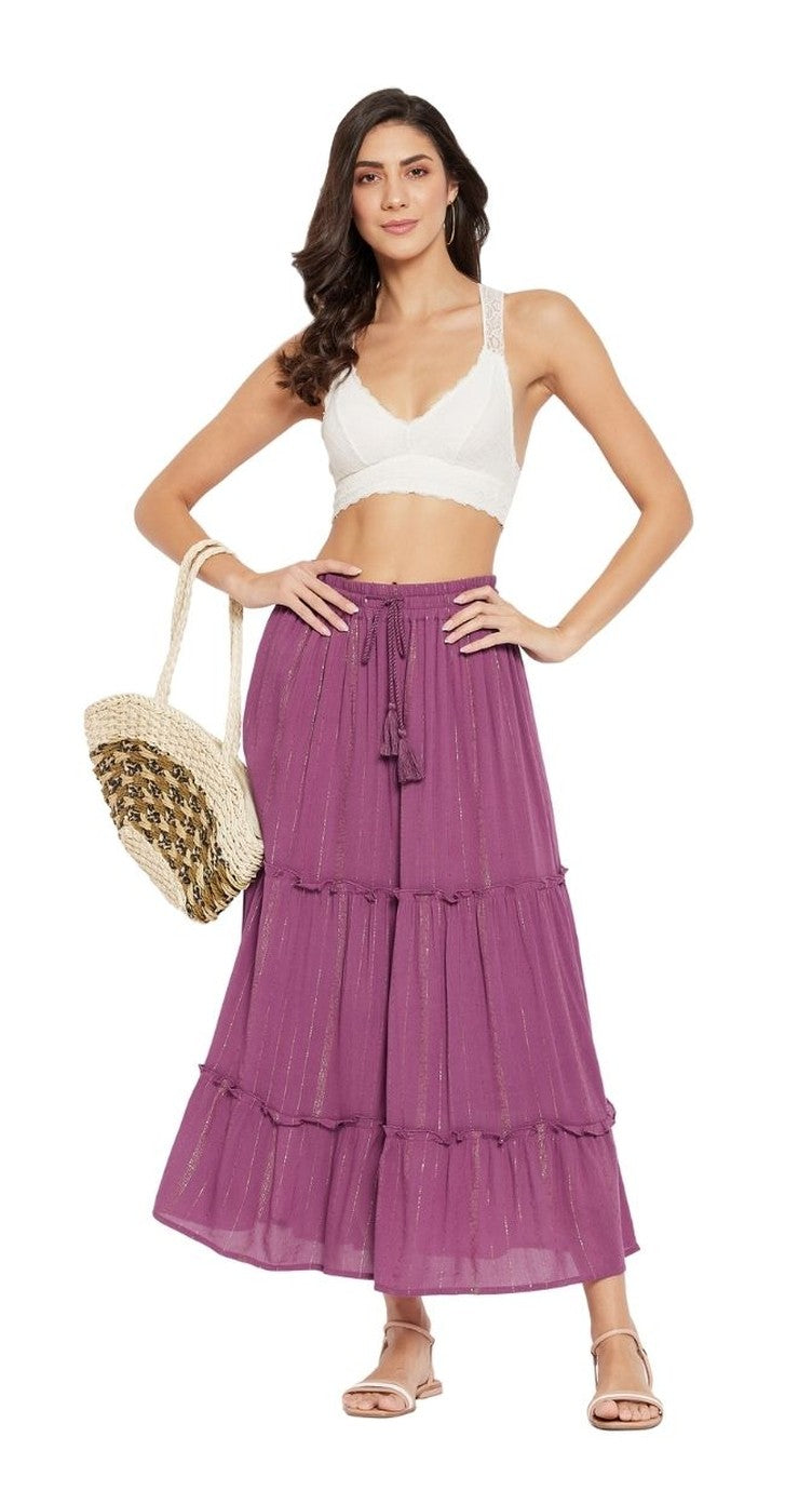 Magenta rayon tiered maxi skirt with lurex stripe and tassel drawstring, worn with a white bralette